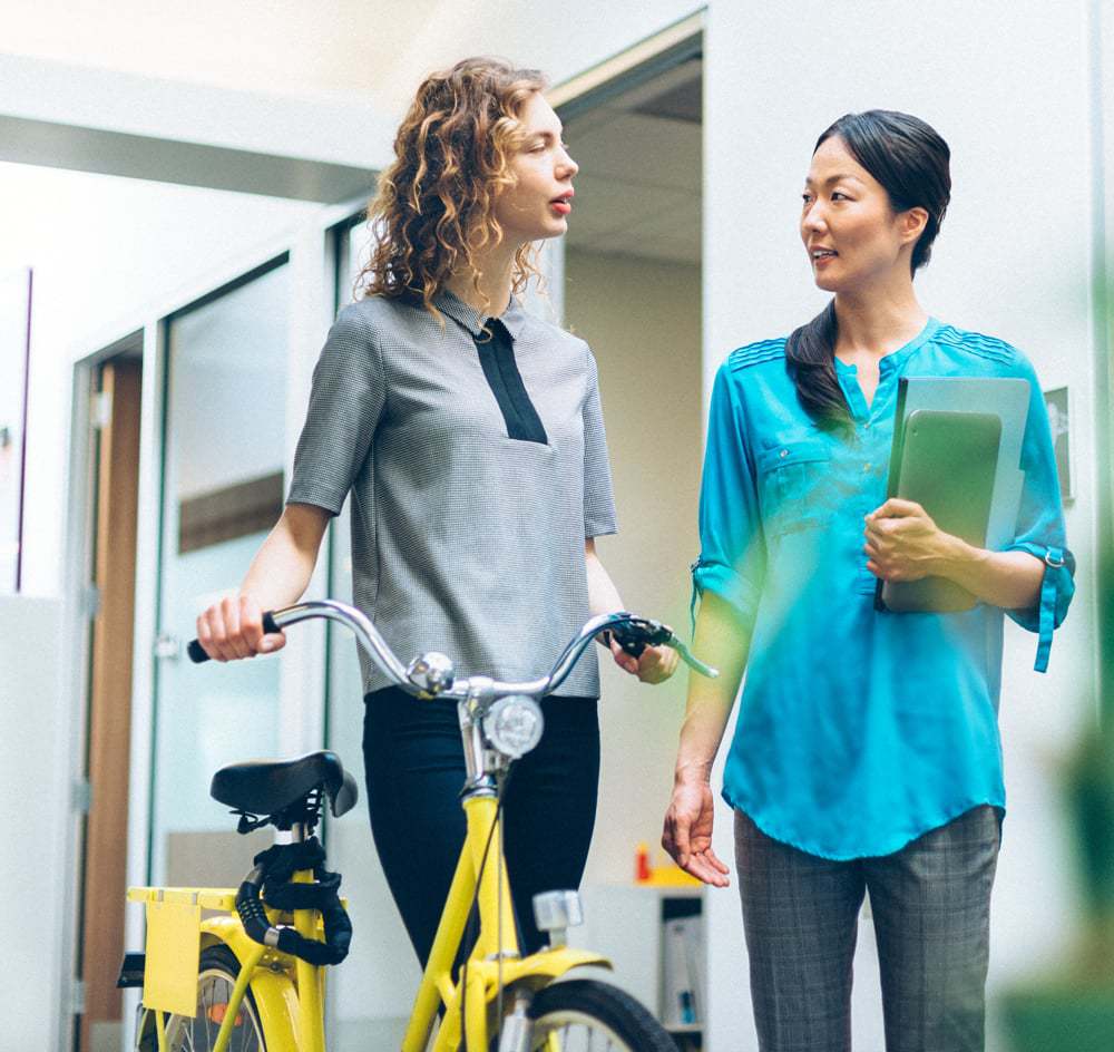 Female Patient Holding A Yellow Bike