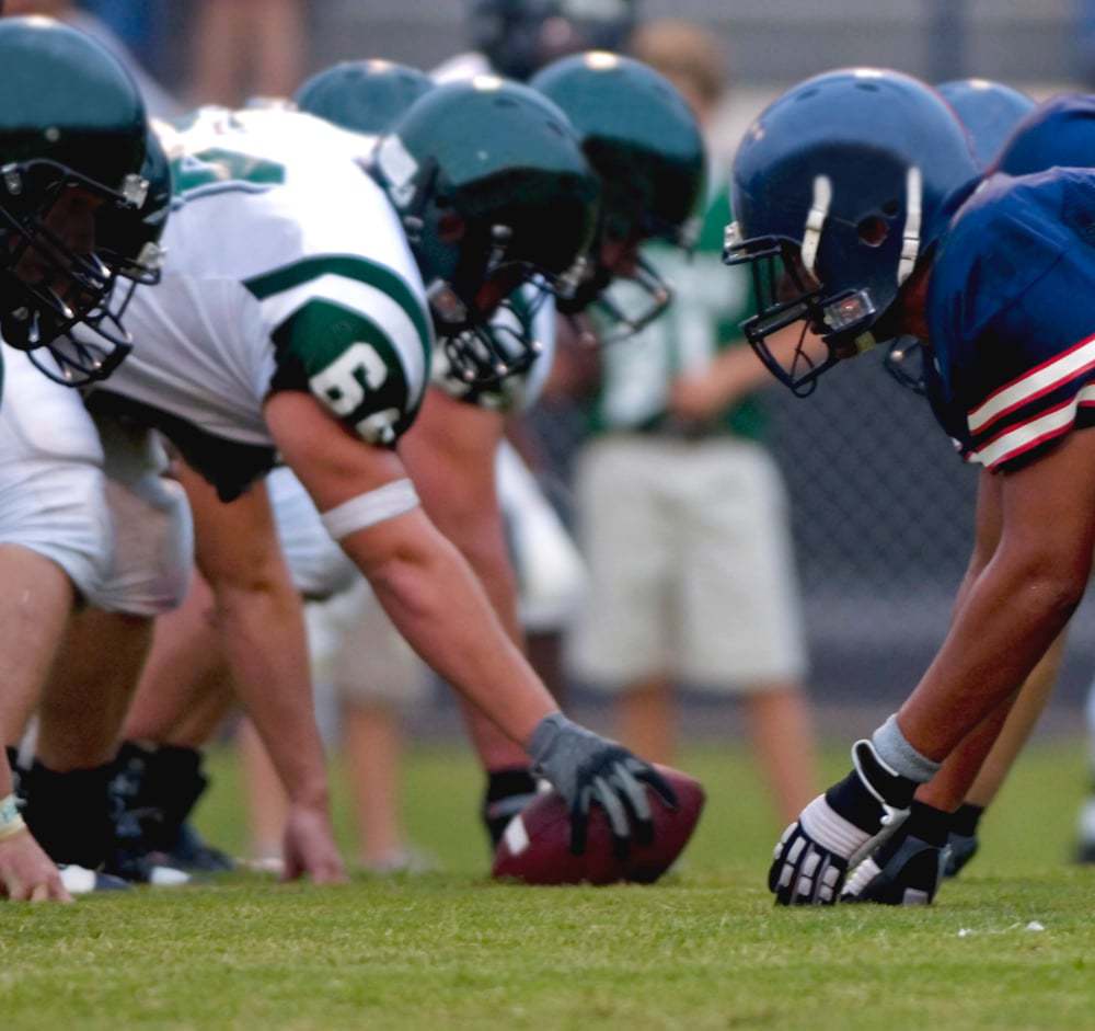 Two Rival Football Teams Line Up