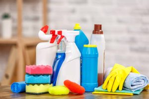 Studio shot of housekeeper's objects. There are bottles with disinfectant