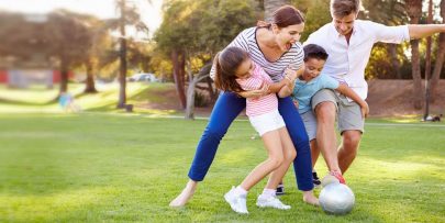 Healthy family playing in the park