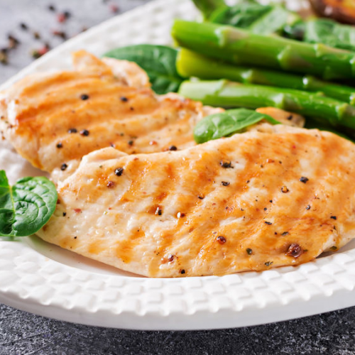 Baked basil chicken over fresh greens and asparagus recipe