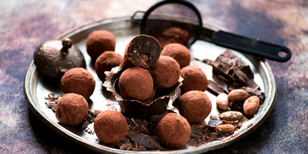 Chocolate candies truffles cocoa beans and chocolate